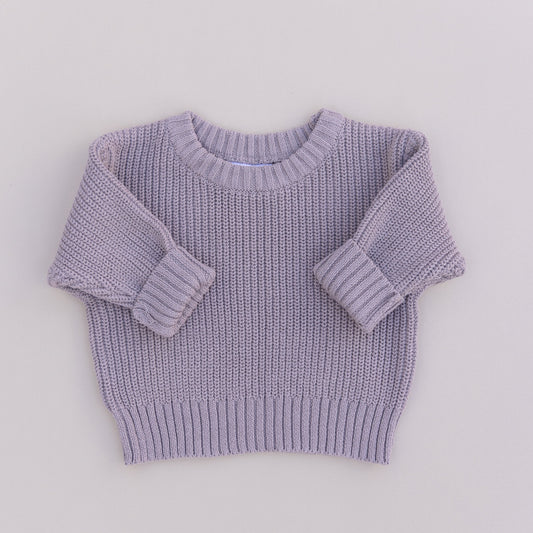 A brown organic cotton knit sweater for babies, displayed against a white background.