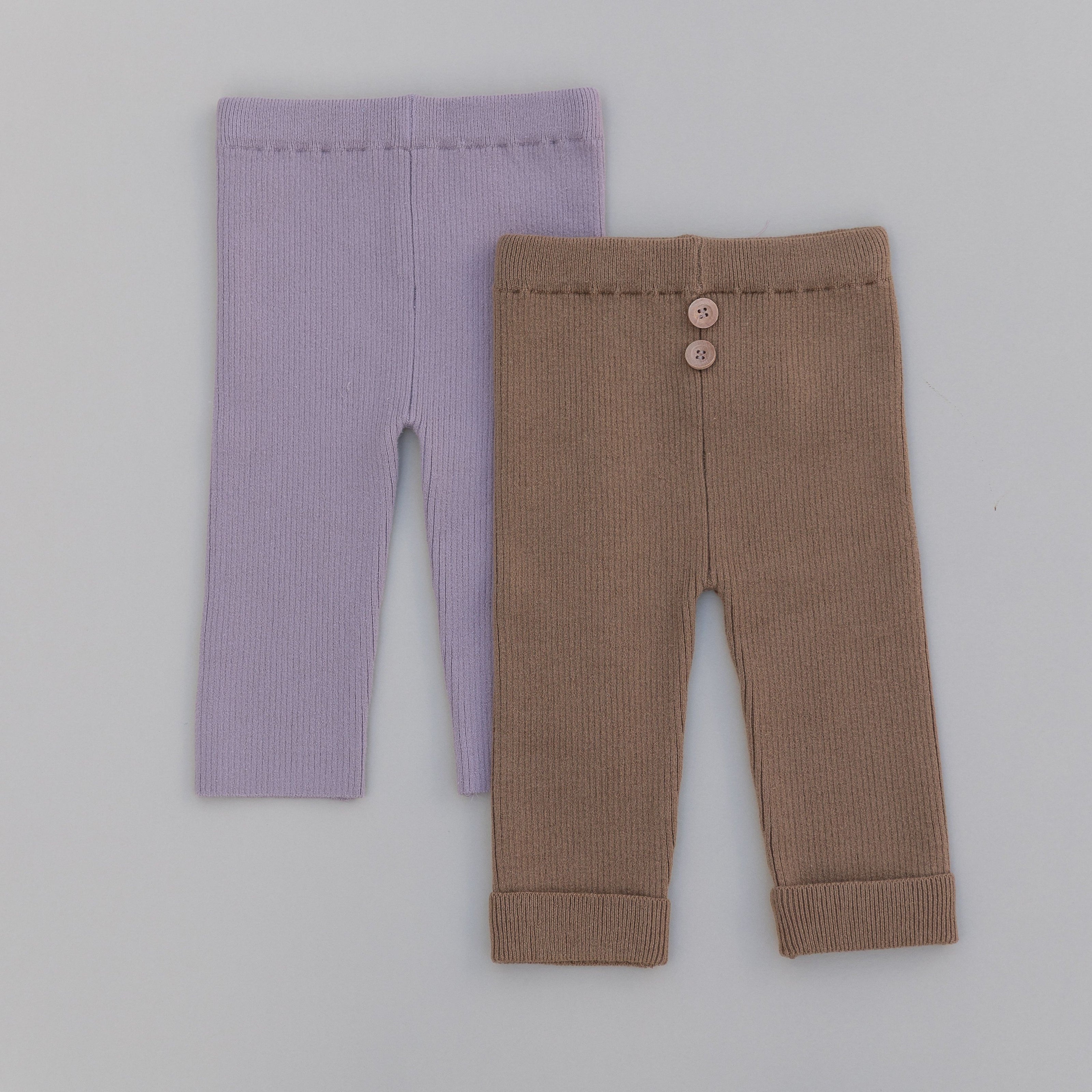 Purple and brown baby leggings on a gray background
